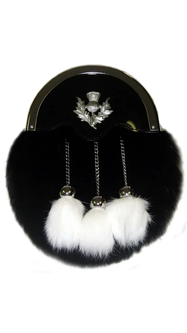 A black purse with white fur dangling from it's side.